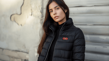 A woman wearing a heated jacket while walking down the street